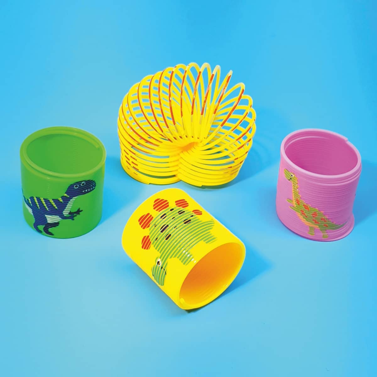 Treppenläufer Slinky Dinosaurier-Motive in bunten Farben